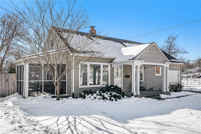 view of front of property featuring a sunroom