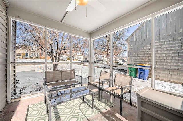 sunroom / solarium with ceiling fan