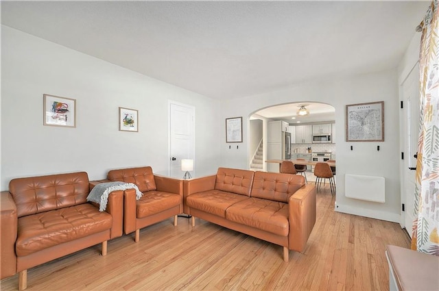 living room with light hardwood / wood-style floors