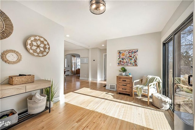 living area featuring hardwood / wood-style floors