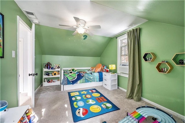 carpeted bedroom with ceiling fan and vaulted ceiling