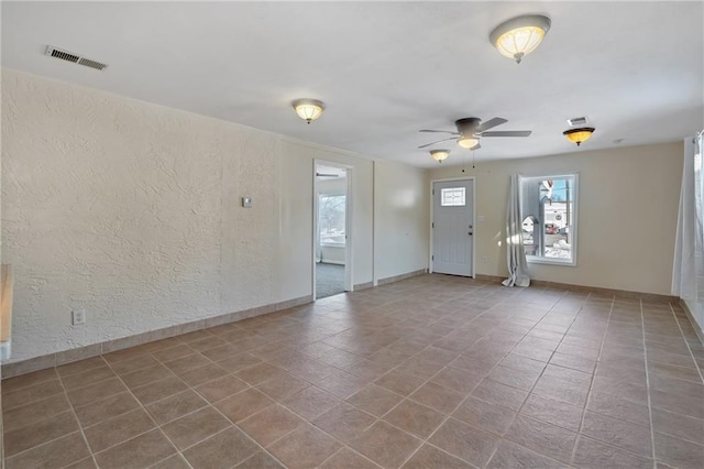 unfurnished room with ceiling fan