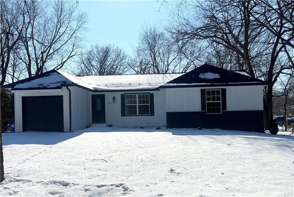 ranch-style house featuring a garage