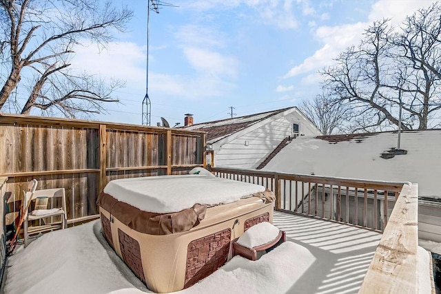 wooden terrace with a hot tub