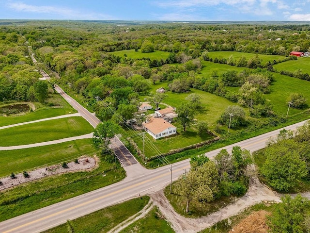 drone / aerial view with a view of trees