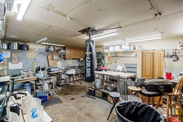 interior space featuring concrete flooring and a workshop area