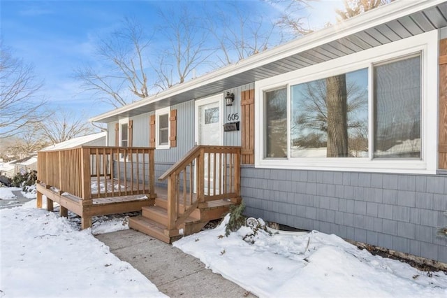 view of snow covered property entrance