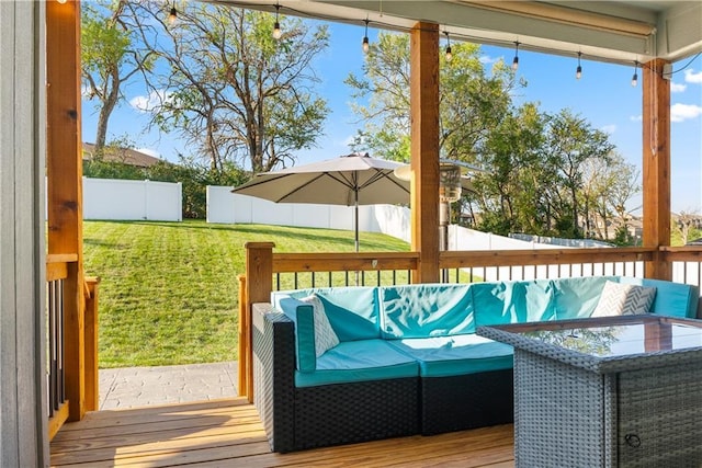 wooden terrace with a lawn