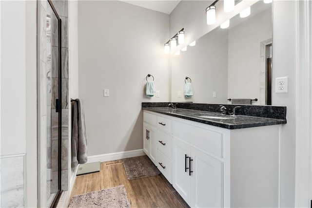 bathroom featuring vanity and hardwood / wood-style floors