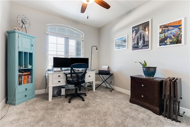 carpeted home office with ceiling fan