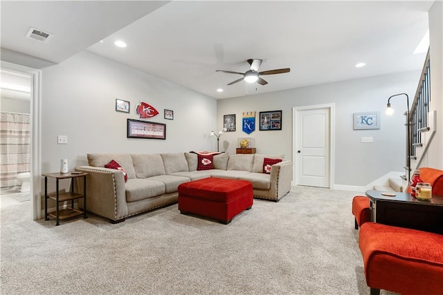 carpeted living room featuring ceiling fan