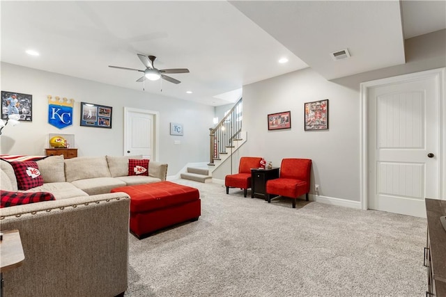 carpeted living room featuring ceiling fan