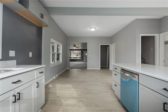 kitchen featuring stainless steel dishwasher, ceiling fan, light hardwood / wood-style flooring, and sink