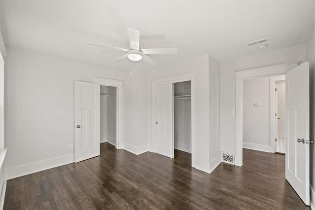 unfurnished bedroom with ceiling fan and dark hardwood / wood-style floors