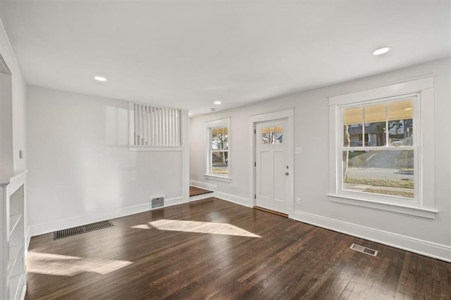 foyer entrance with dark hardwood / wood-style flooring