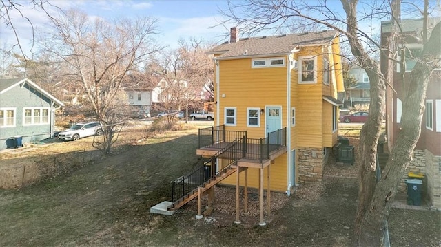 back of house with cooling unit