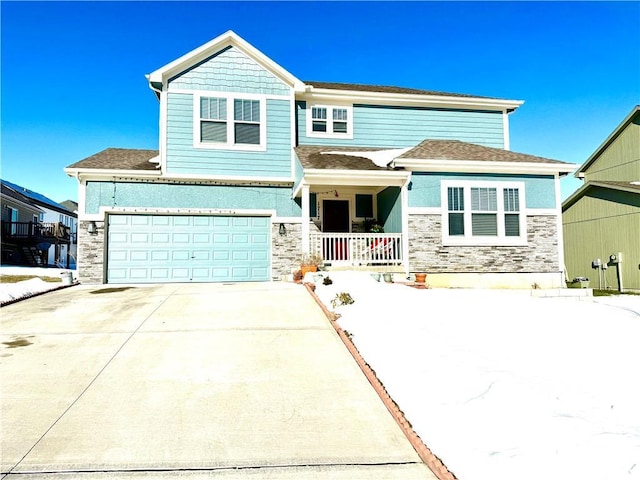 craftsman-style house with covered porch and a garage