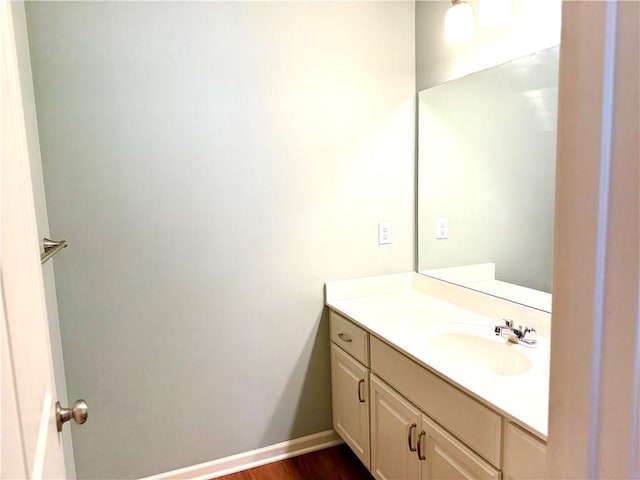 bathroom with hardwood / wood-style flooring and vanity