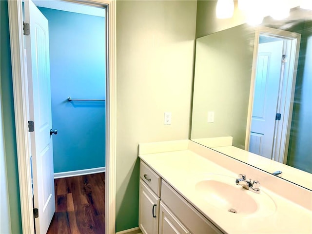 bathroom featuring vanity and hardwood / wood-style flooring