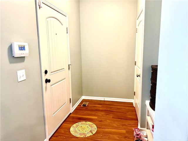 doorway to outside with hardwood / wood-style floors