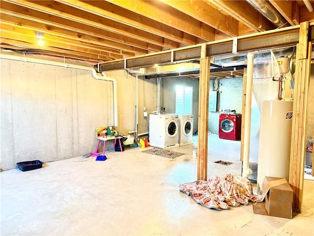 basement featuring washer and dryer and gas water heater