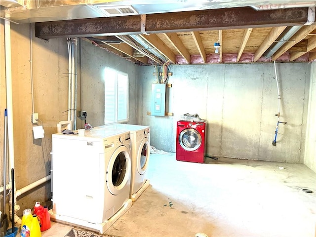 basement with separate washer and dryer and electric panel