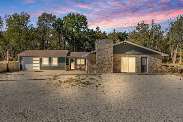 single story home with a garage