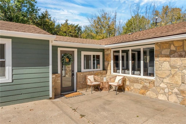 entrance to property featuring a patio