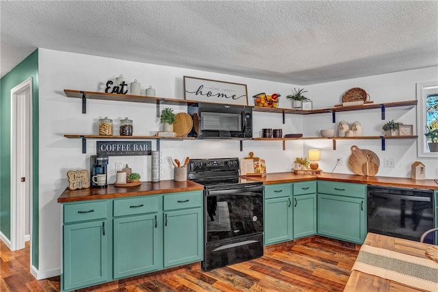 kitchen featuring black appliances, dark hardwood / wood-style flooring, wood counters, and a textured ceiling