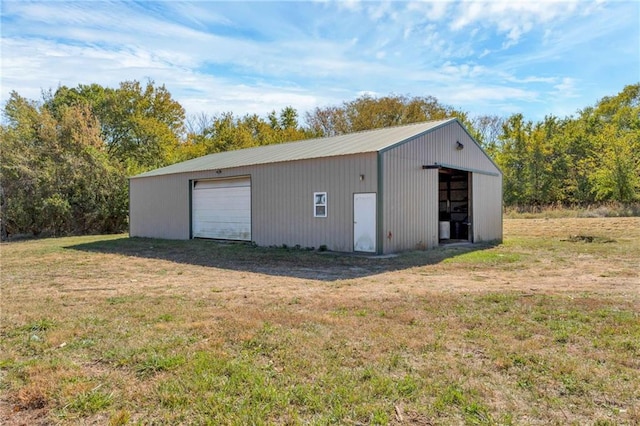 garage featuring a yard