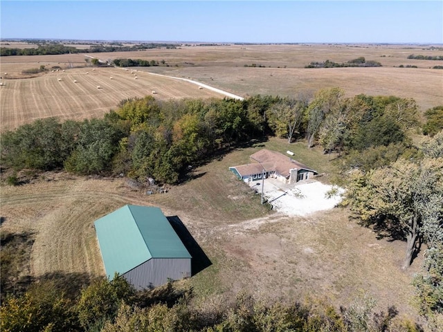 birds eye view of property with a rural view