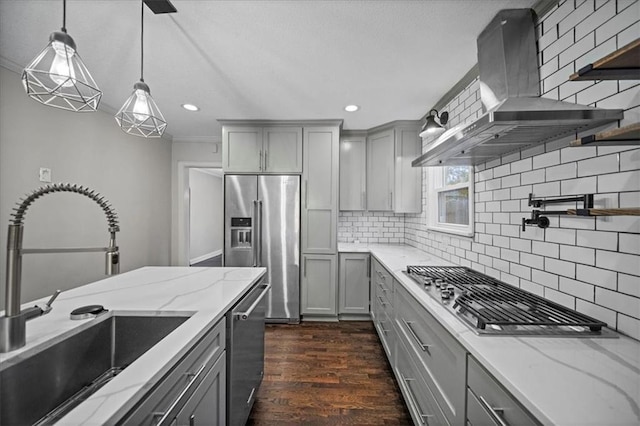 kitchen with stainless steel appliances, extractor fan, sink, and gray cabinetry