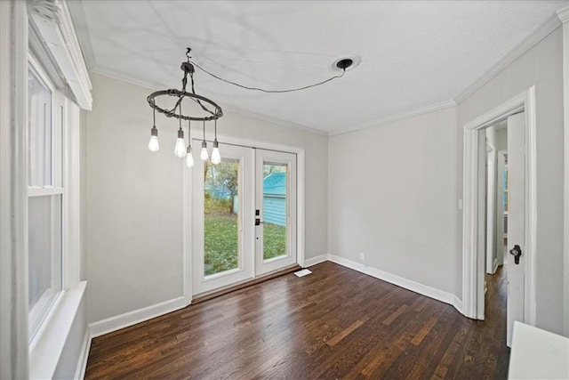 empty room with ornamental molding, dark hardwood / wood-style flooring, and french doors