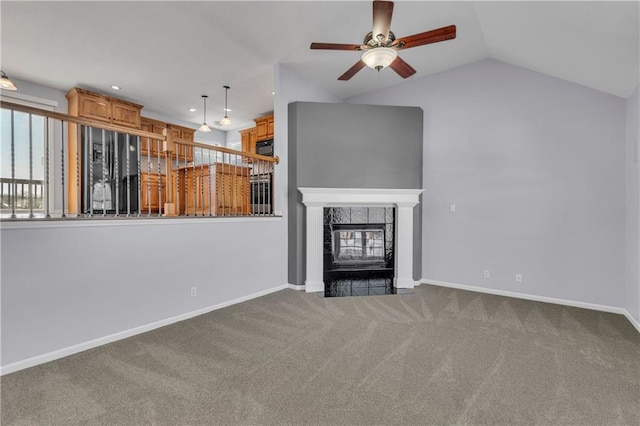 unfurnished living room featuring lofted ceiling, a fireplace, ceiling fan, and carpet floors