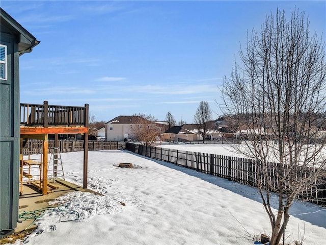 view of yard layered in snow