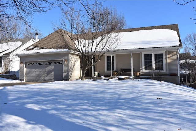 view of front of home featuring covered porch and a garage