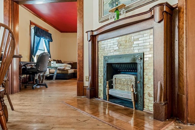 interior space with crown molding and light hardwood / wood-style flooring