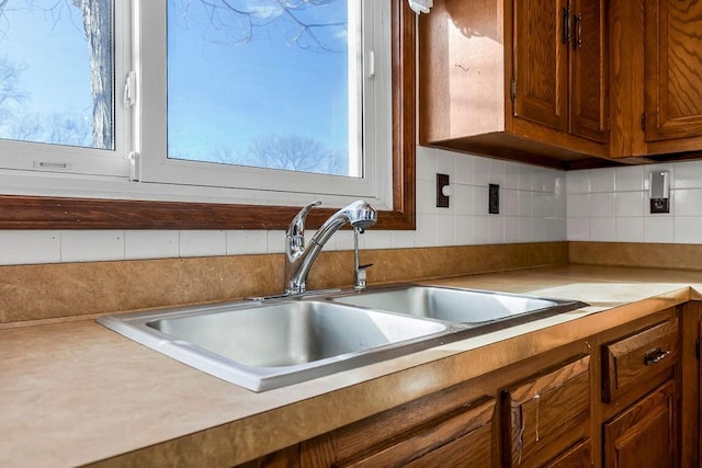 kitchen featuring sink and decorative backsplash