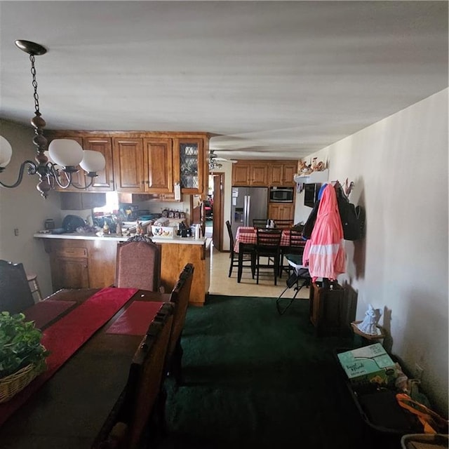 dining space featuring a notable chandelier