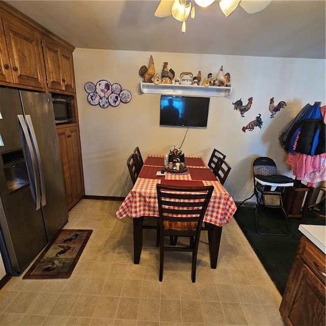 dining room featuring ceiling fan