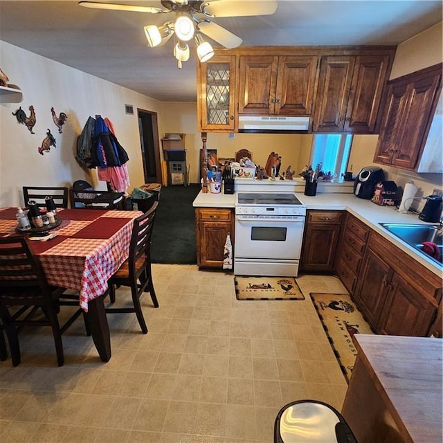 kitchen with sink, ceiling fan, and white electric range