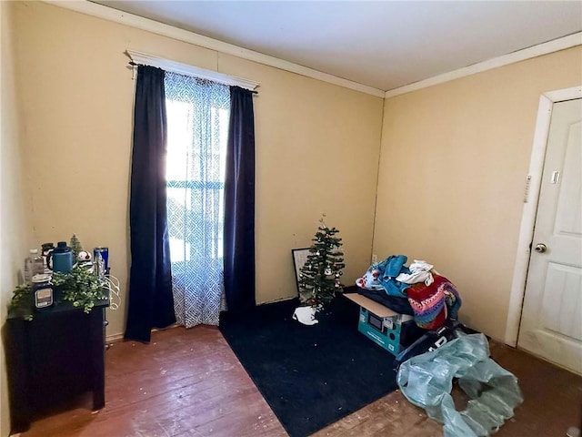 interior space with crown molding and wood-type flooring