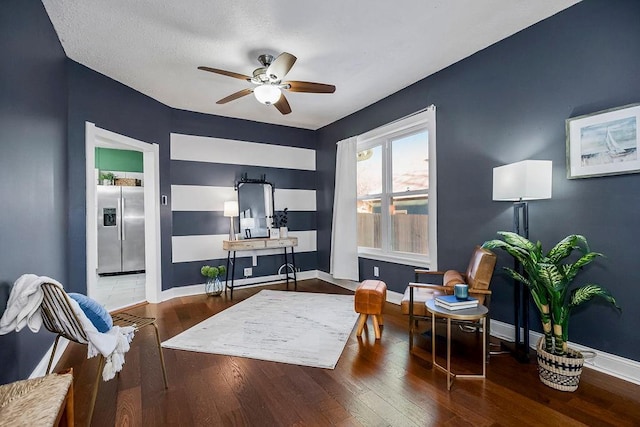 interior space featuring hardwood / wood-style floors and ceiling fan