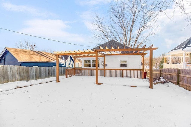 snow covered house with a pergola