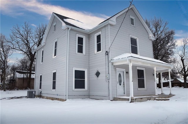 view of front facade featuring a porch and cooling unit