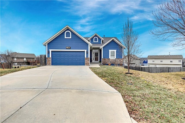 view of front of house with a garage and a front yard