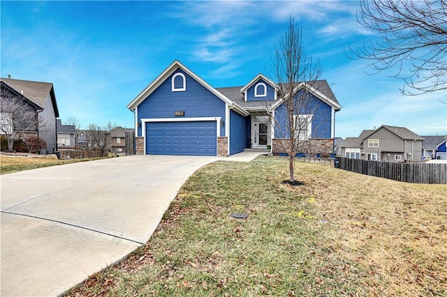 view of front of home with a garage and a front yard