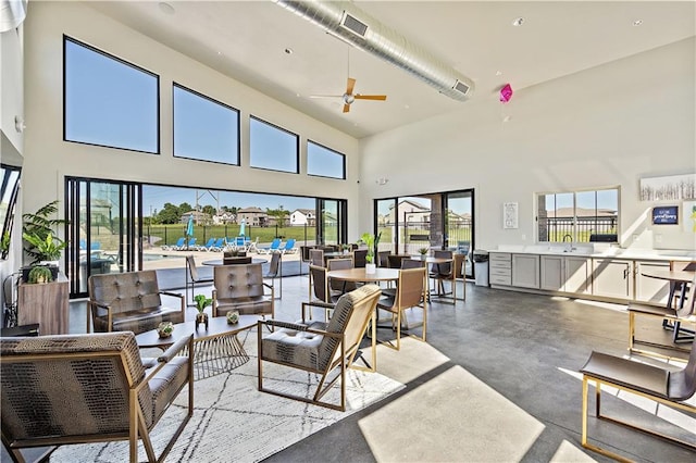 interior space with ceiling fan