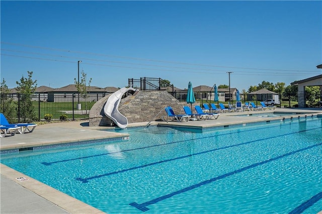 view of swimming pool featuring a patio area and a water slide