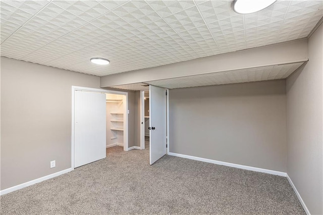 unfurnished bedroom with a spacious closet, carpet floors, and a closet